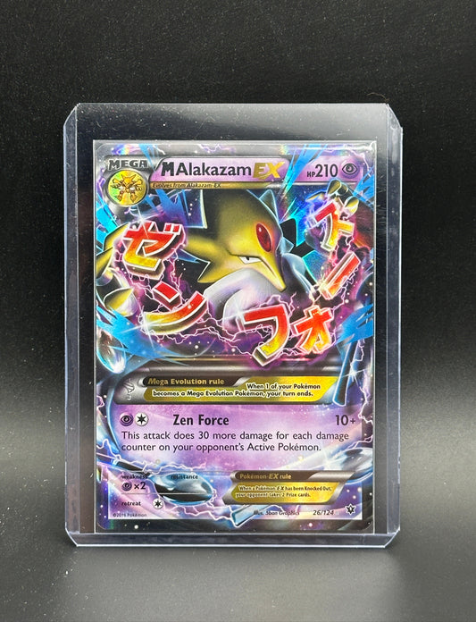 Pokémon trading card featuring M Alakazam EX in a clear protective case on a dark surface