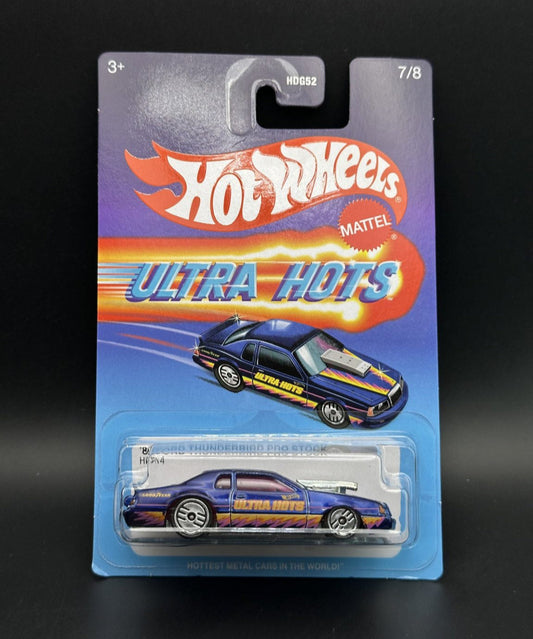 Hot Wheels Ultra Hots toy car in packaging on a black background
