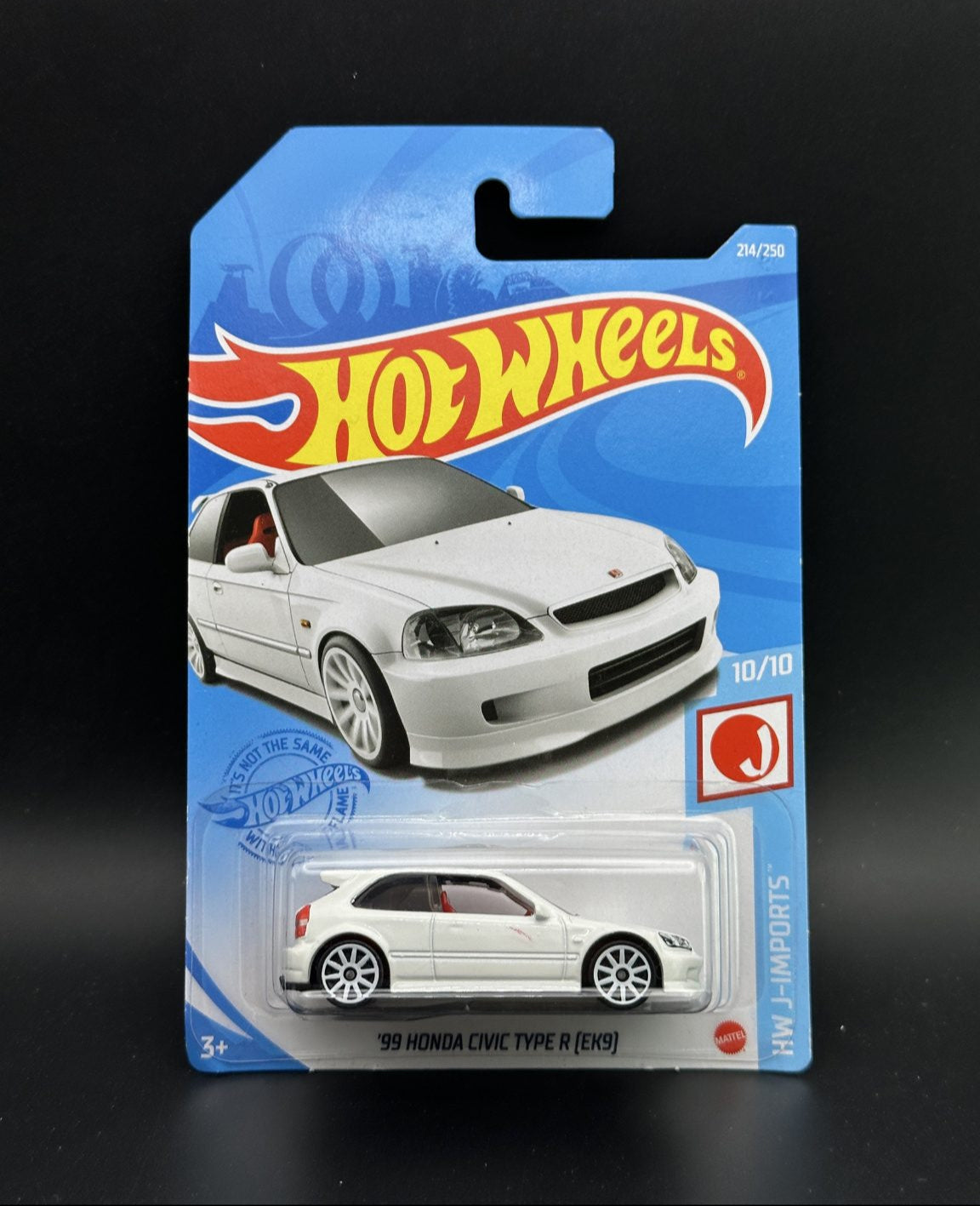 Hot Wheels packaging with a white car model on a black background