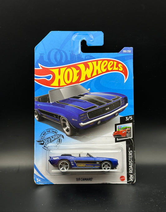 Hot Wheels toy car in packaging on a black background
